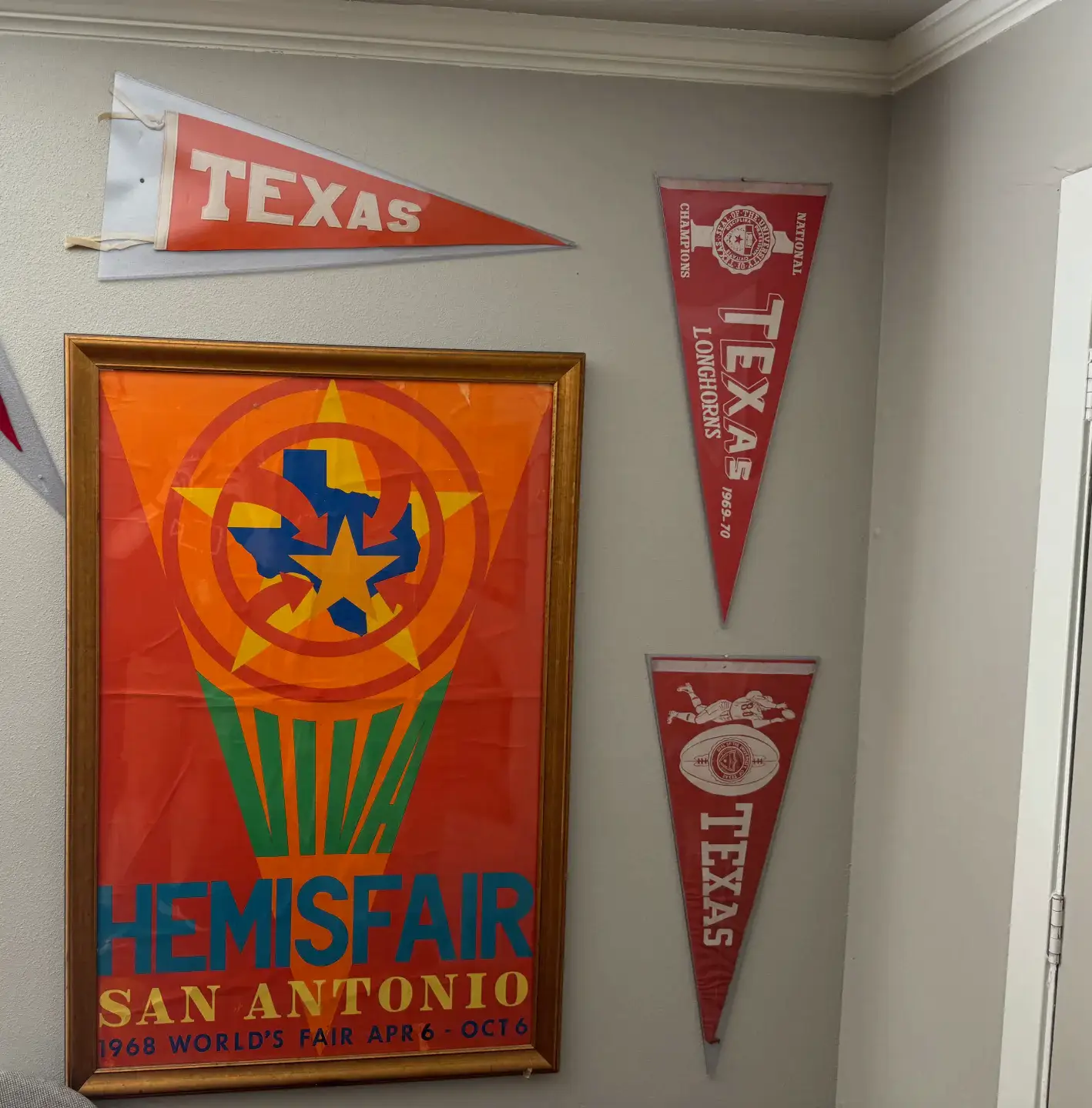 Vintage pennants and a framed 1968 HemisFair San Antonio world fair poster